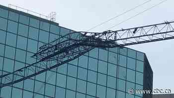 Crane collapses onto downtown Toronto building