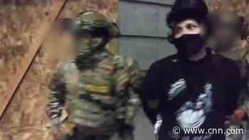 Mysterious arrest video with unidentified police raises questions