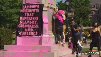 Police charge 3 people after Black Lives Matter protesters splatter paint on statues in Toronto