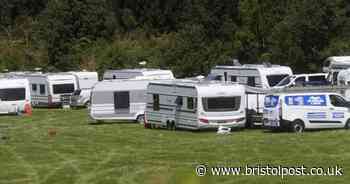 Group of travellers set up illegal camp on fields near Bristol