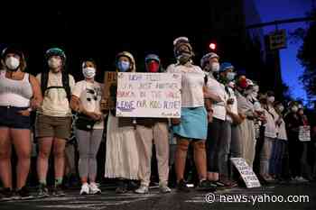 Women in Portland form "Wall of Moms" to protect protesters