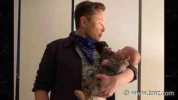 Elon Musk Posts Pic of Son, Jokes Infant's Spoon Skills are Lagging