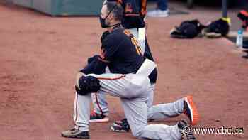 Giants manager Gabe Kapler leads kneeling protest during U.S. anthem