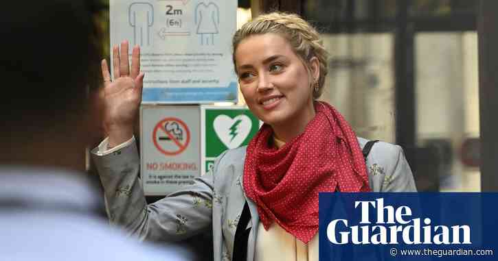 Amber Heard says she punched Johnny Depp to defend her sister