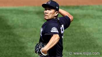 Yankees' Tanaka throws during batting practice