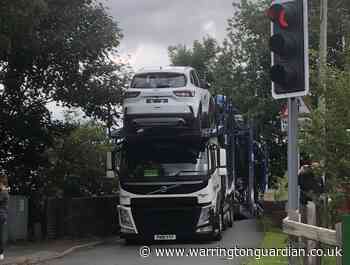 Lorry stuck on Bridgewater Canal bridge on Oughtrington Lane