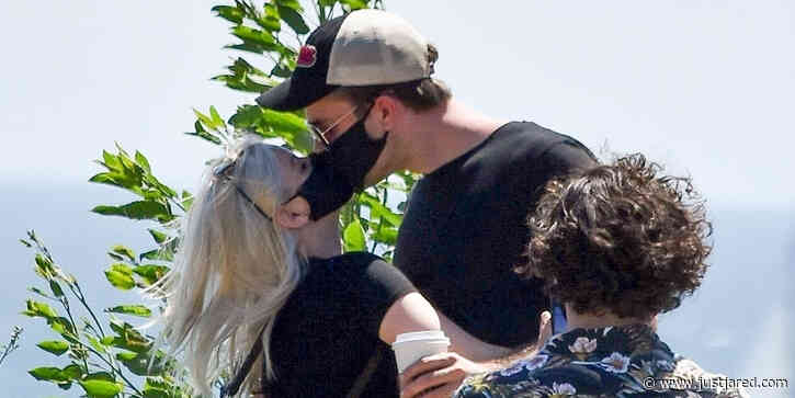 Ariel Winter & Boyfriend Luke Benward Kiss Through Their Masks