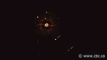 Telescope snaps photograph of 2 planets orbiting baby sun