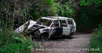 Burnt-out car discovered in Bolton park - Manchester Evening News