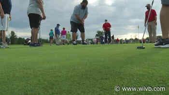 Veterans taking golf lessons as part of therapy program