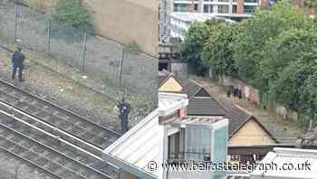 Arrest made and knife seized after person runs onto train tracks in east London