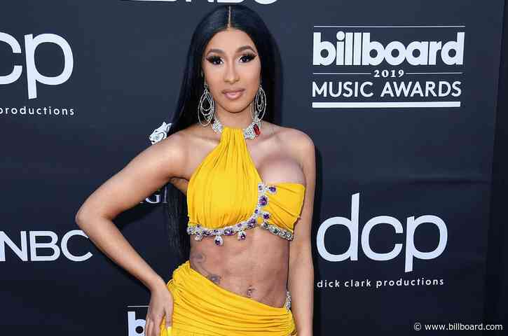 Cardi B Lays Luxuriously by the Pool in Leopard Bikini & Sparkling Accessories