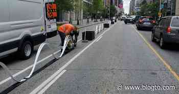 Toronto bike lane gets new barrier shaped like ocean waves - blogTO