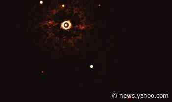 Scientists reveal first-ever photo of a solar system like ours