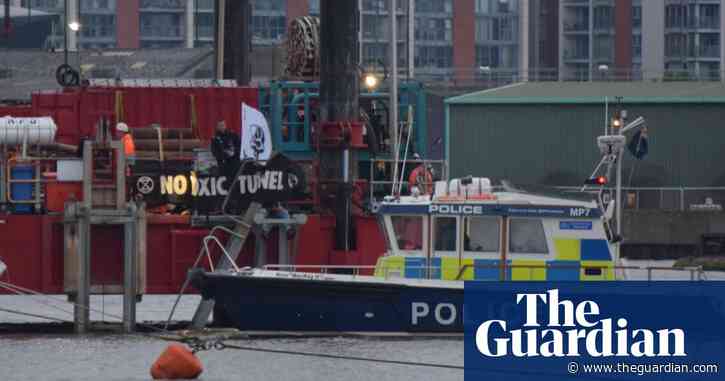 Extinction Rebellion protesters lock themselves to rig on River Thames