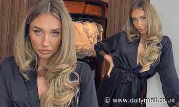 Megan McKenna sizzles in black silk robe as she puts in her glamorous hair extensions in Marbella