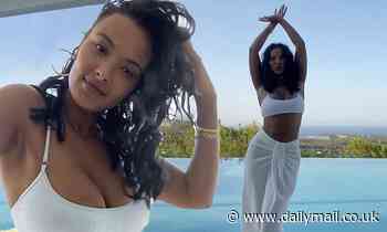 Maya Jama flaunts her sensational curves in a busty white bikini as she dances by a pool in Ibiza