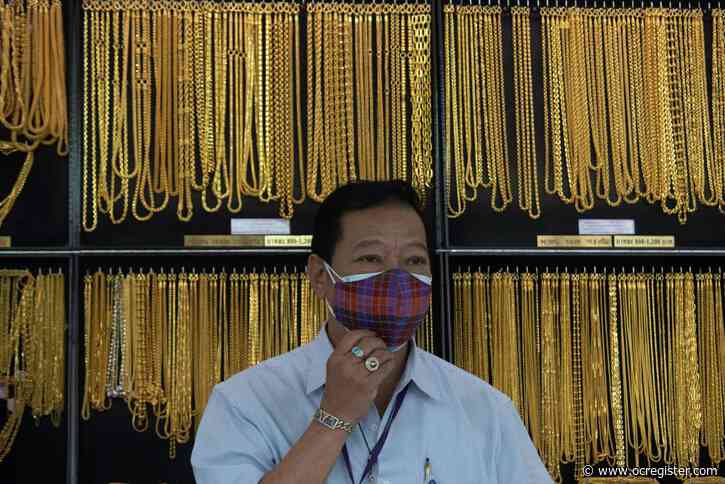 Coronavirus uncertainty pushes gold to record price, over $1,930 per oz
