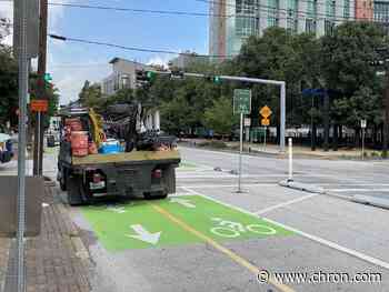 Houston mulls changing weird green parking spots into bike lanes