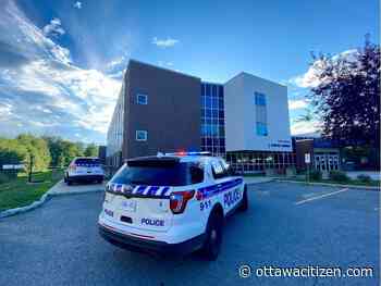 Man found dead behind school died of gunshots, police say