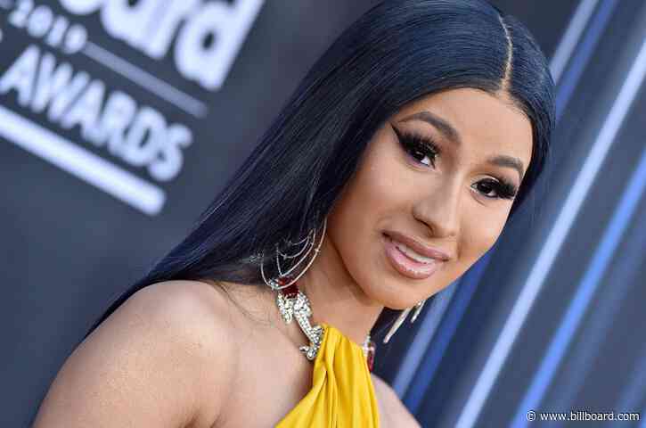 Cardi B Is Scorching in Louis Vuitton Outfit (& Matching Hair)