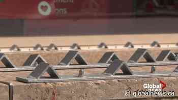 Metal barriers block sitting space on Jasper Avenue