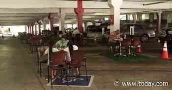 Would you eat in a parking garage? Mall converts spaces into an outdoor eatery