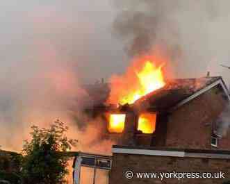 Firefighters tackle major fire at house 'struck by lightning' in Haxby