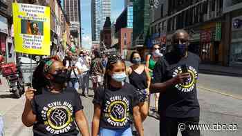Marchers in Toronto call for end to systemic anti-Black racism on Emancipation Day - CBC.ca