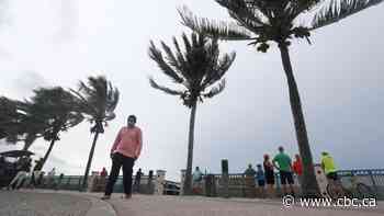 Downgraded Isaias churns along Florida's Atlantic coast, bringing heavy rains