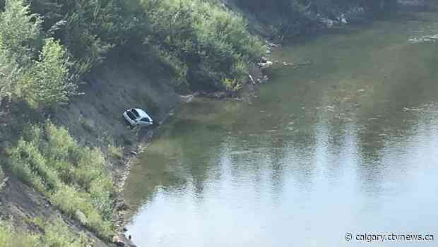 No one believed injured after vehicle slides down embankment near Elbow River