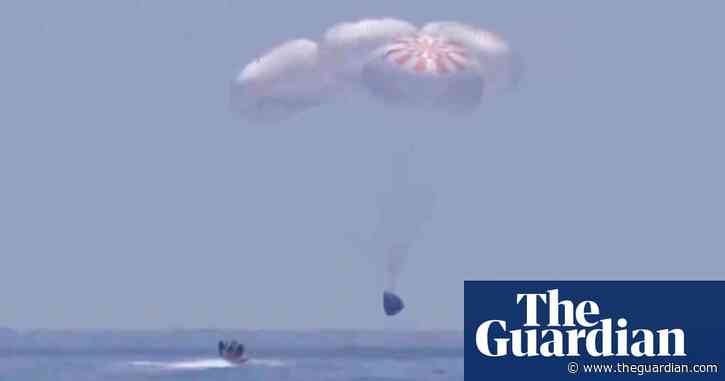 Nasa astronauts aboard SpaceX capsule make first splashdown in 45 years