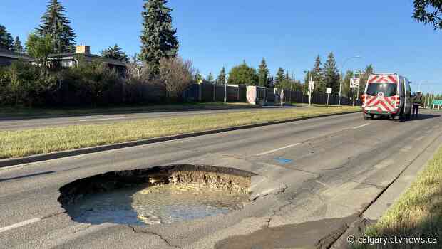 Large sinkhole opens up in southwest Calgary road