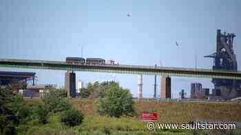 Few vehicles crossing bridge