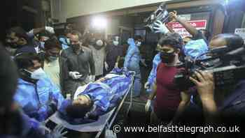 At least 14 dead and dozens injured after plane skids off runway in India