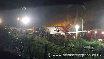At least 16 dead and dozens injured after plane skids off runway in India