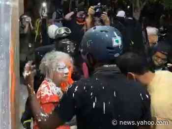 Woman confronting vandals covered in paint during renewed Portland protests