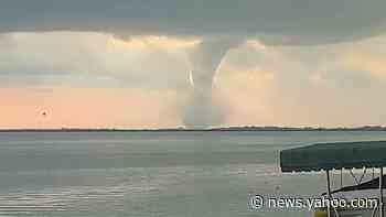 Funnel Cloud Looms Over Lake in Manitoba, Canada - Yahoo News