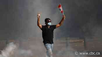 Security forces fire tear gas at Beirut protesters denouncing deadly chemical explosion
