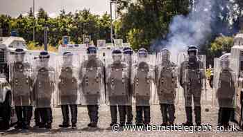 Police come under attack while removing bonfire material in west Belfast - 26 officers injured