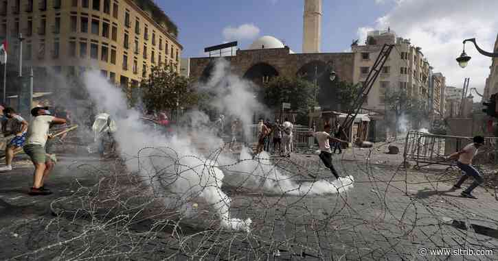 Tear gas, clashes in Beirut amid fury over massive blast