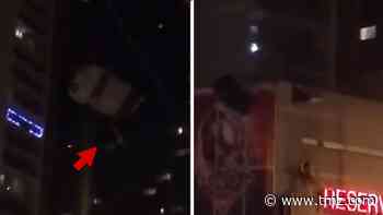 Guy Parachutes Right Into Apartment Building in Cleveland at Night