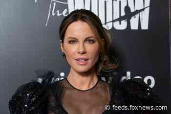 Kate Beckinsale poses in sultry bikini to show off hilarious, bizarre furniture for her cat