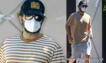 Bradley Cooper wears a striped t-shirt and face mask while hanging at a pal's Santa Monica home