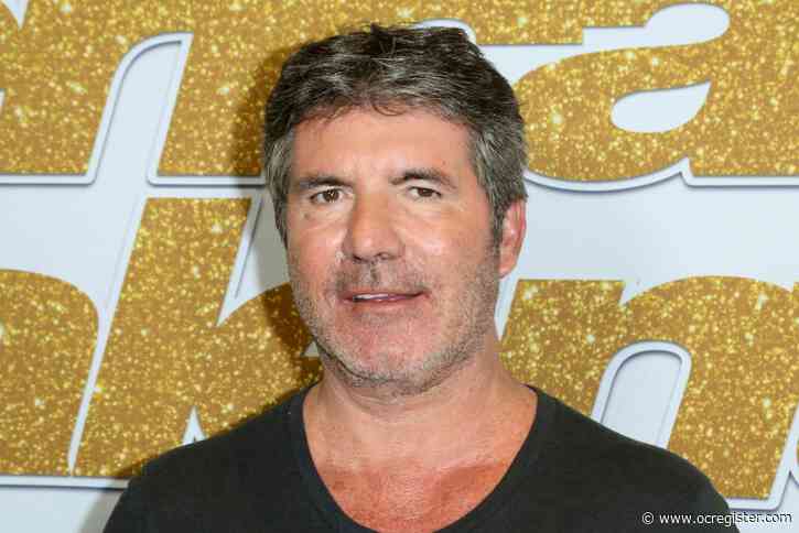 Simon Cowell breaks his back while riding his new electric bicycle