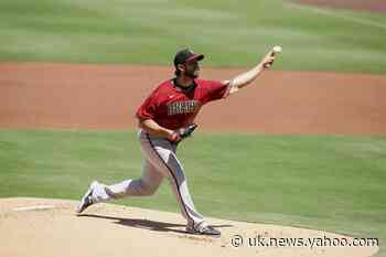 Arizona places Bumgarner on injured list with back strain