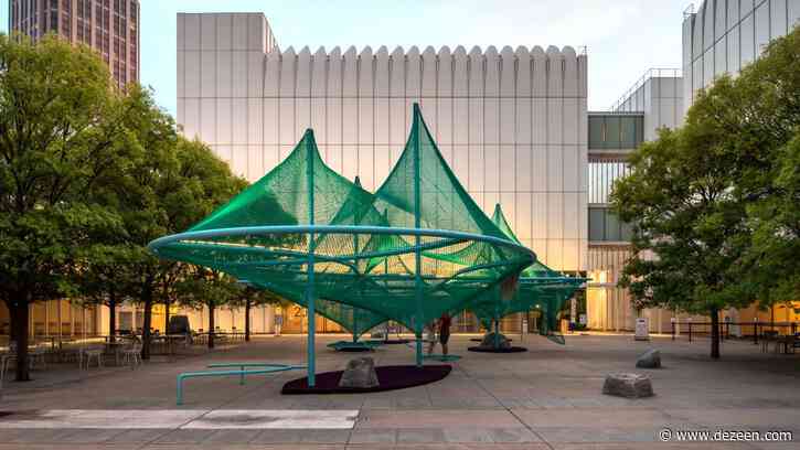 Green net shades hammocks and bird feeders in Murmuration by SO-IL