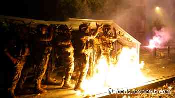 Beirut cop killed in anti-government clashes as Macron calls on world to help