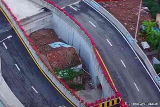 Chinese city builds bridge around woman’s house after she refused to move