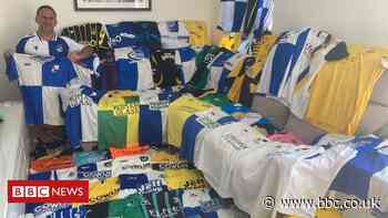 Bristol Rovers football shirt fan close to away goal